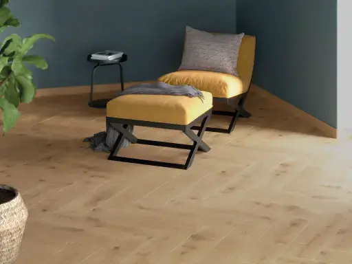 Cozy seating area with light wood-look floor, yellow lounge chair with matching pouf, blue-grey wall and a plant in a basket.