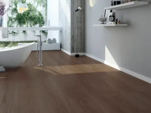 Modern bathroom with freestanding bath, large windows, warm wood-look floor and floating white wall shelves.